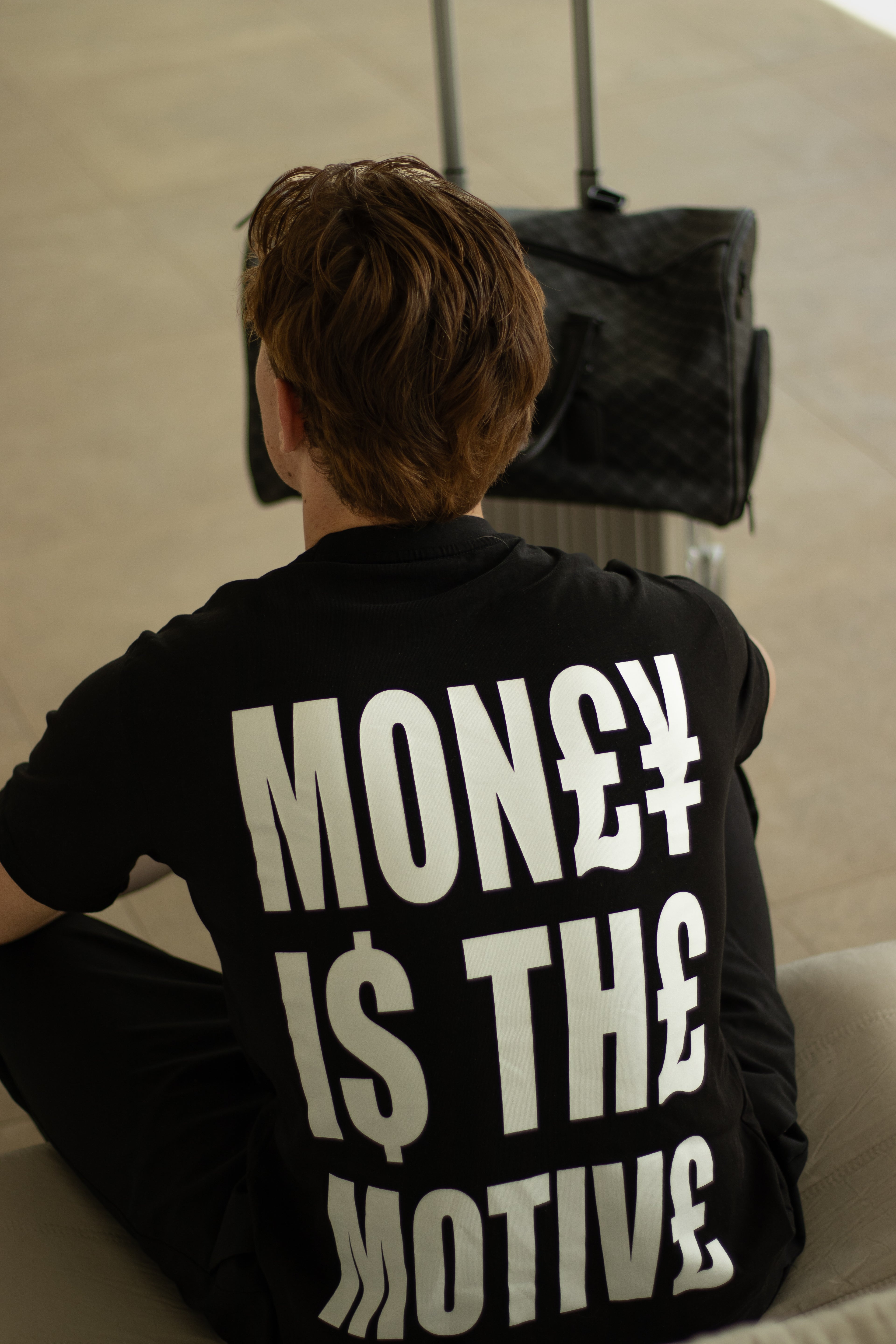 MONEY IS THE MOTIVE TEE