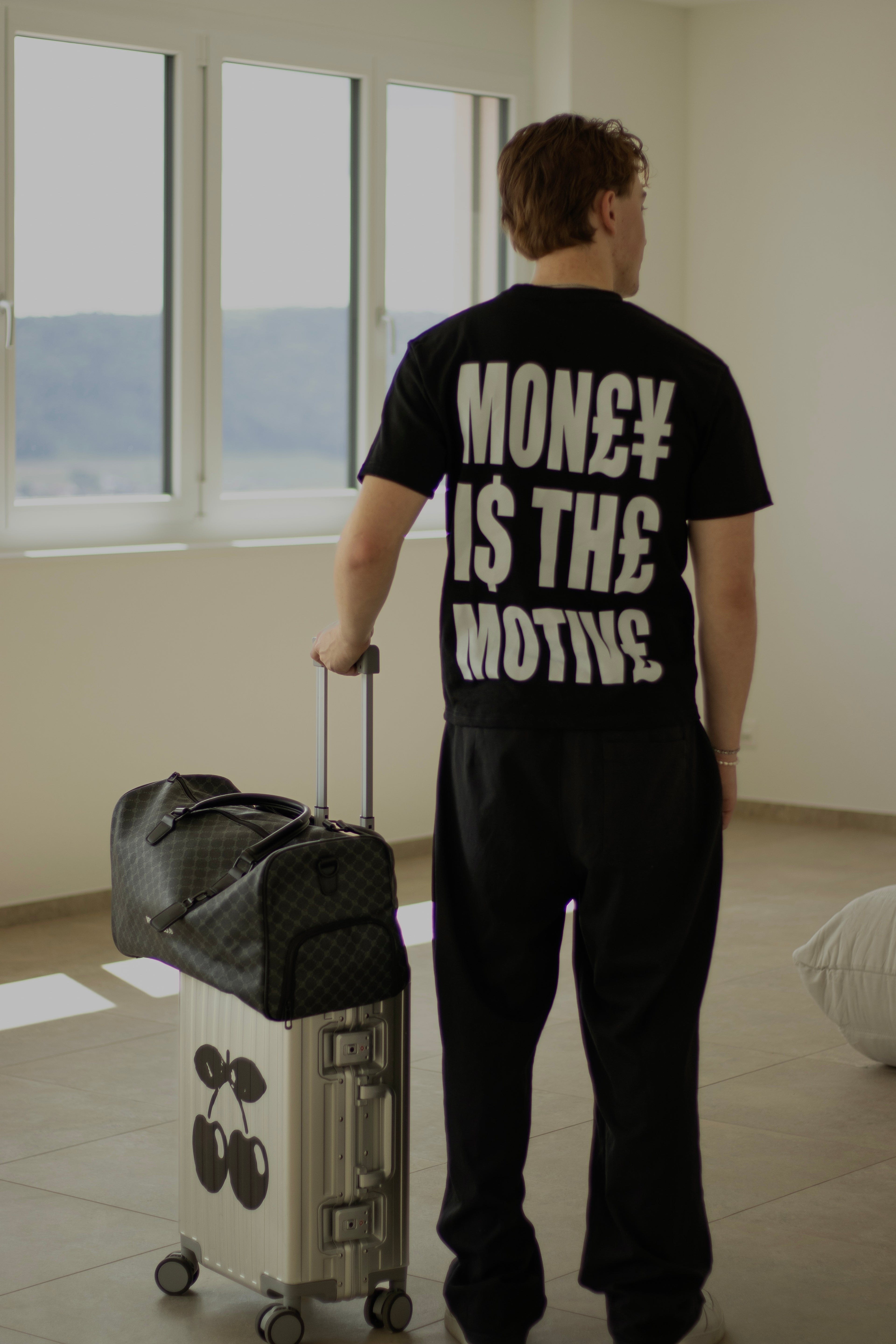 MONEY IS THE MOTIVE TEE